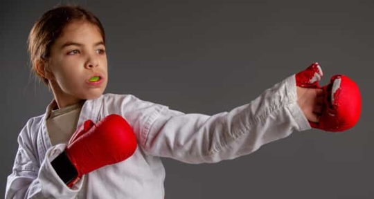 Girl fighting with mouthguard